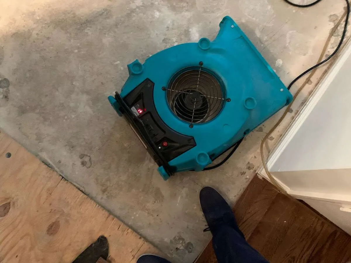 Air mover drying subfloor during Leak Detection & Repair in Blacksburg